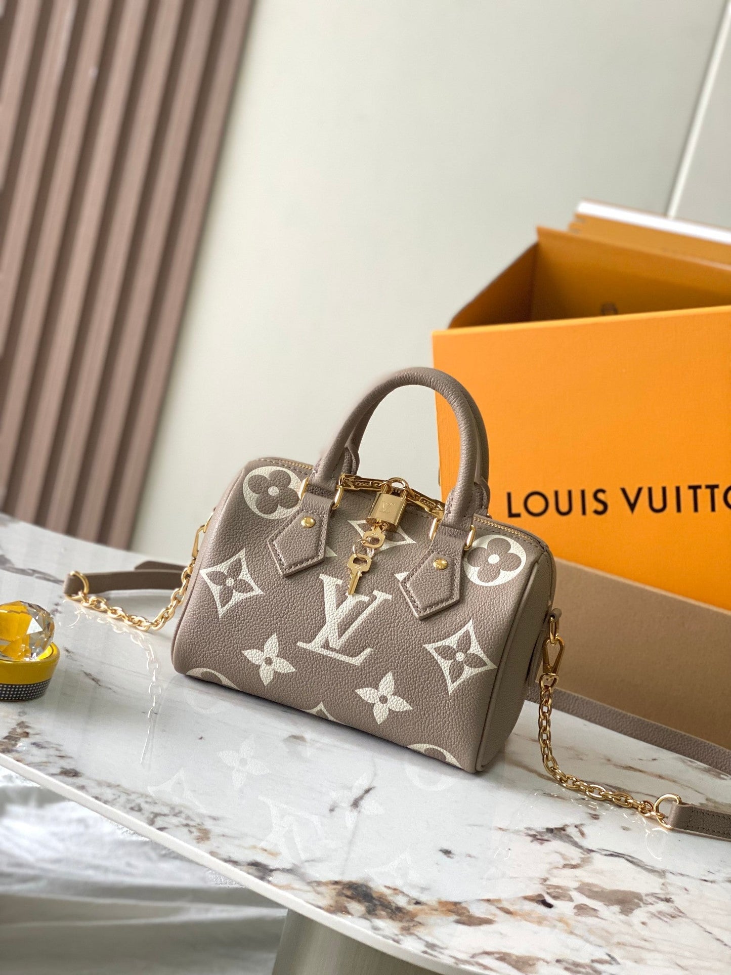 LOUIS VUITTON SPEEDY BANDOULIÈRE 20 IN TAUPE BROWN AND WHITE MONOGRAM EMPREINTE LEATHER